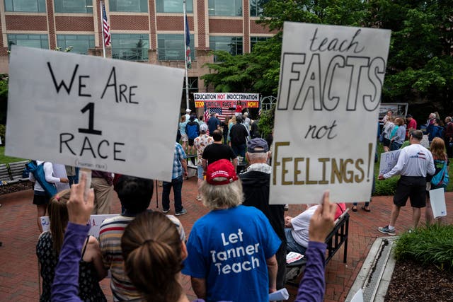 <p>Protesters gather in Virginia on June 12, 2021, to protest critical race theory. Congressman Mark Green has called for an Air Force Academy professor to be fired for teaching CRT to students</p>