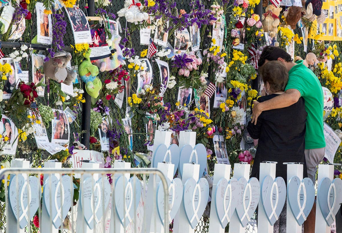 Awaiting news, families of condo victims bond together