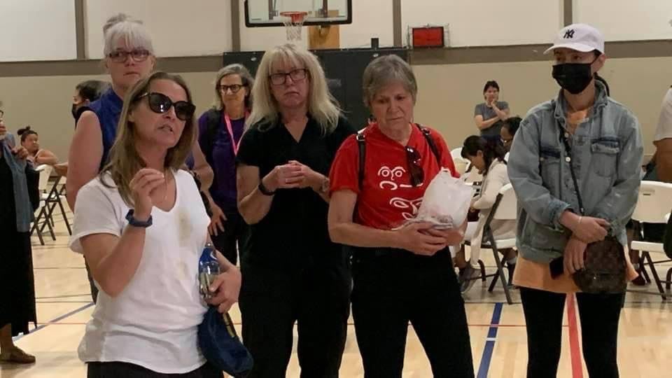 Residents from Lytton congregate at the high school during the tour.