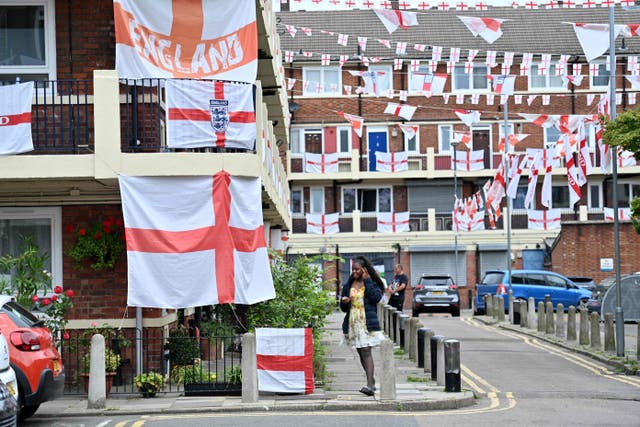 <p>England flags fly on the Kirby Estate in Bermondsey, south London</p>