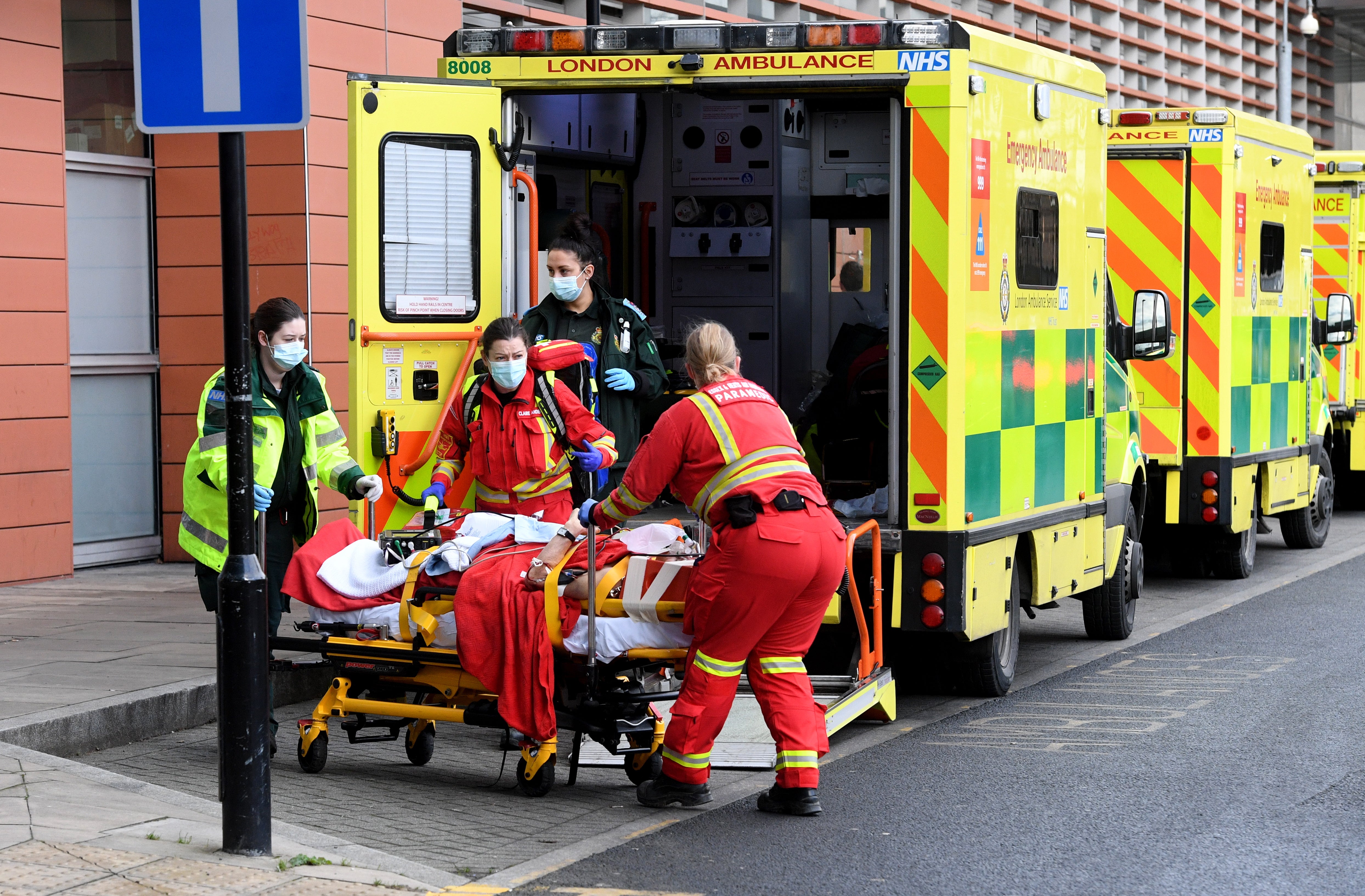 Ambulance workers pictured in January during the Covid wave that cause a huge backlog of NHS treatment