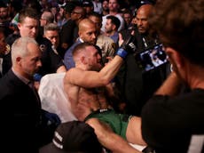 Conor McGregor loses fight against Dustin Poirier after breaking leg in UFC 264 main event as Trump watches on