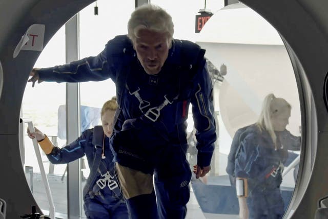 <p>Richard Branson and Virgin Galactic crew members enter the company's passenger rocket plane, the VSS Unity, at Spaceport America near Truth or Consequences, New Mexico, US.</p>