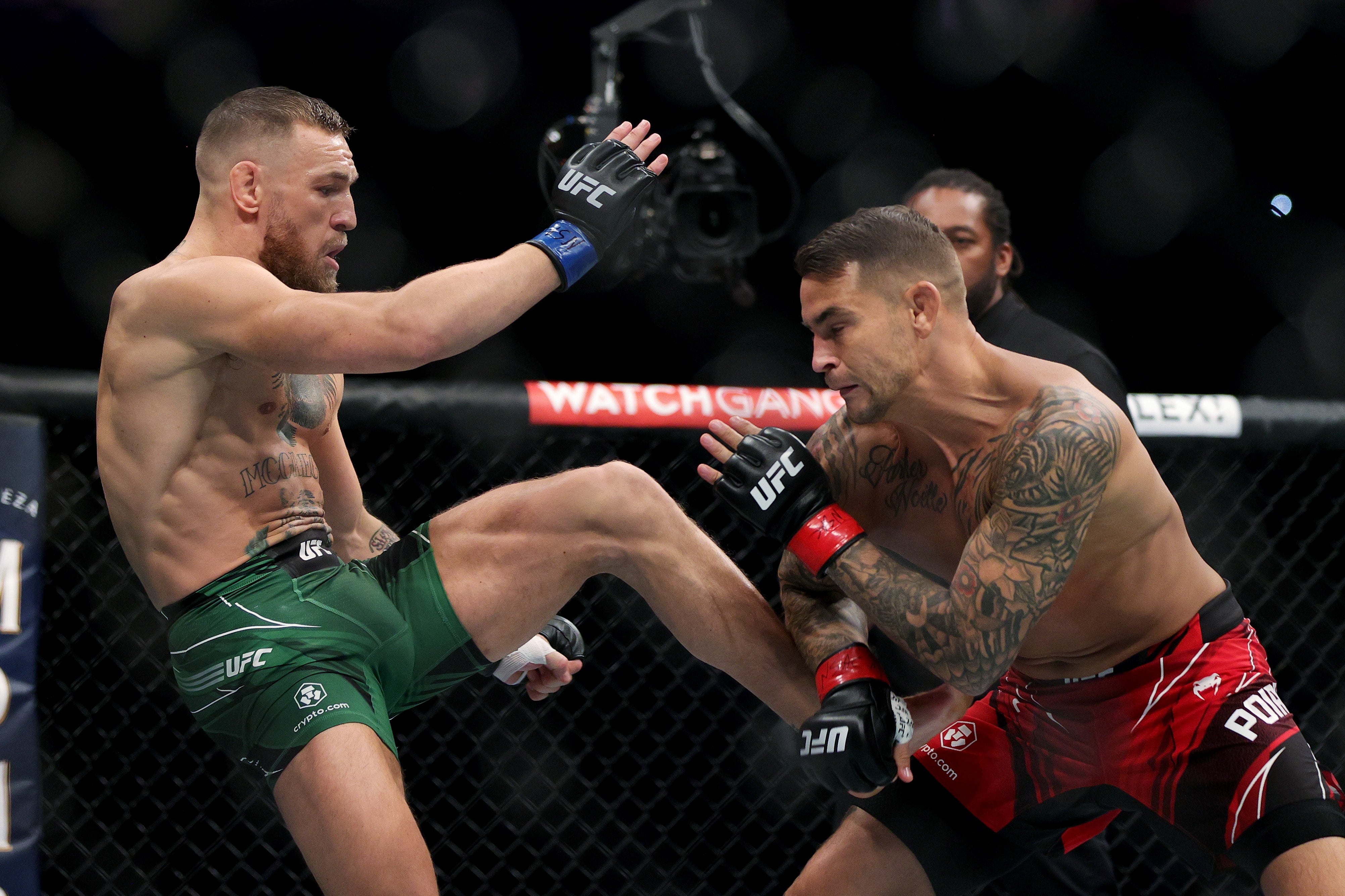 Dustin Poirier (right) in his trilogy bout against Conor McGregor in July