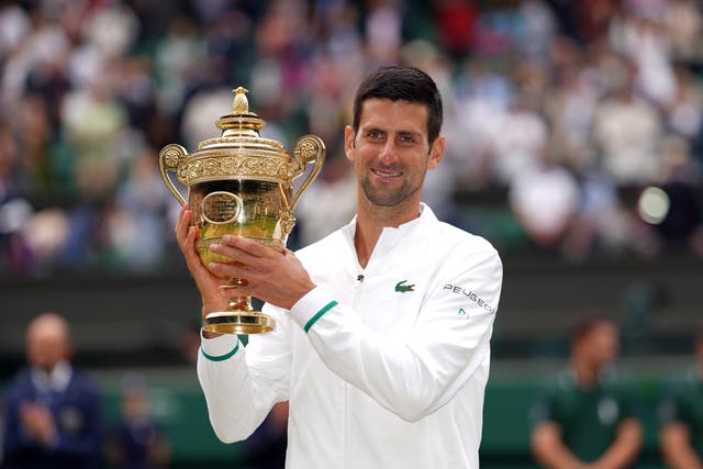 <p>Novak Djokovic holds the Wimbledon trophy again</p>