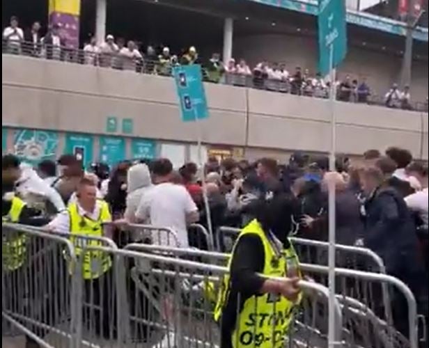 Fans rushed through barriers at Wembley stadium before the Euro 2020 final