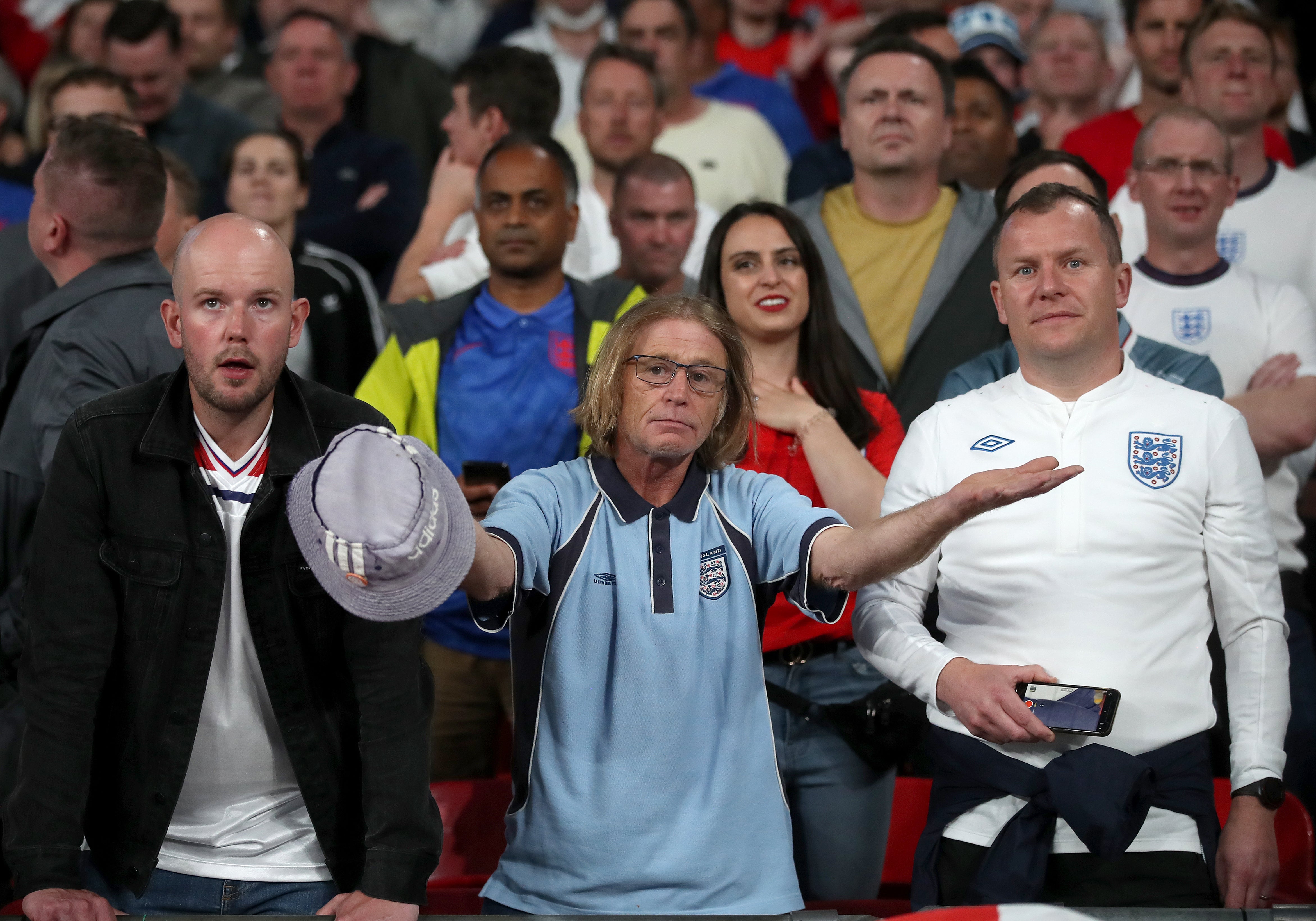 England fans react in the stands after Italy’s Bonucci's equaliser