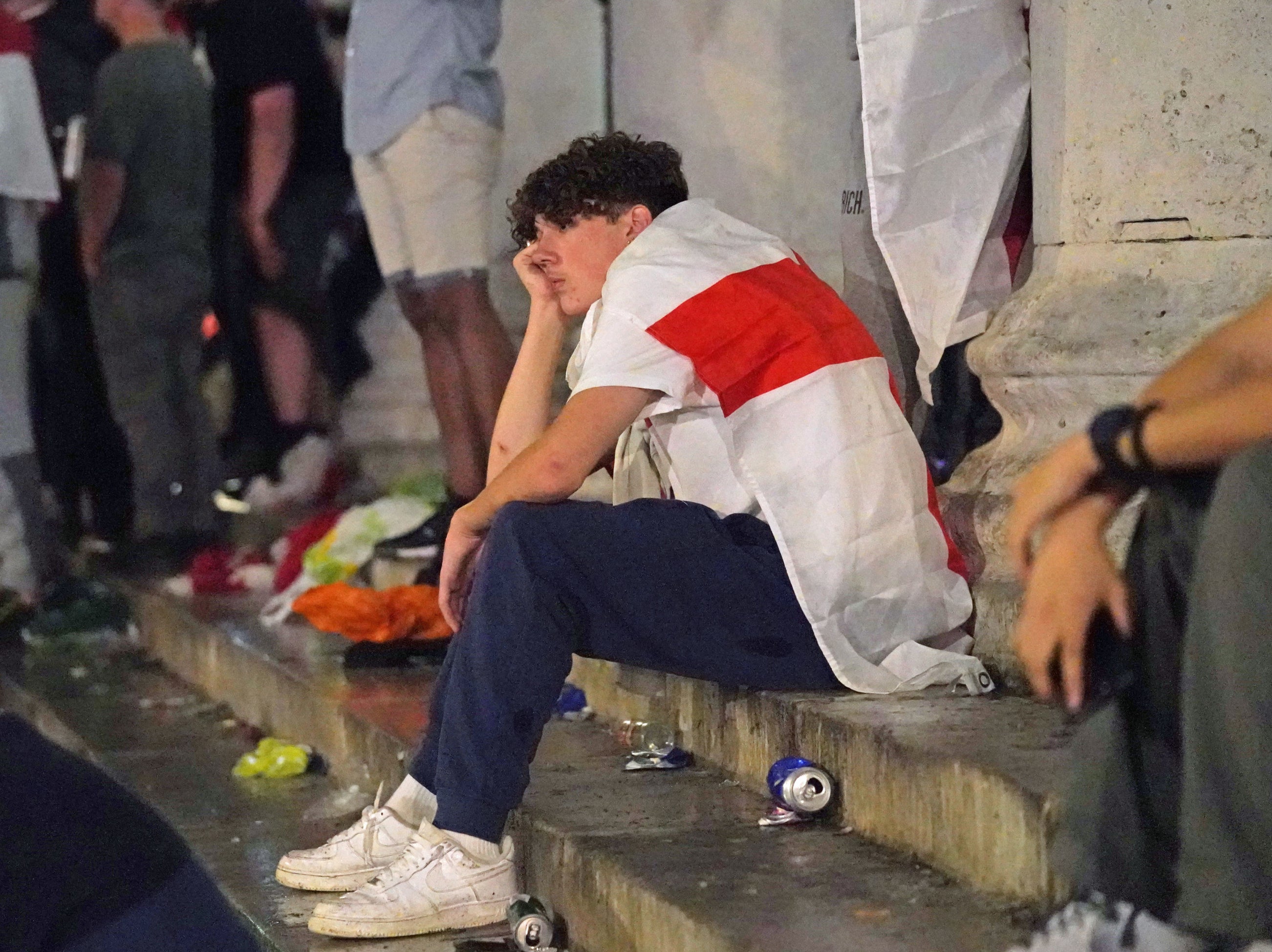 <p>An England fan comes to terms with another penalty nightmare in Trafalgar Square after Italy win on penalties</p>