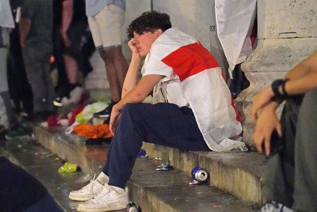 <p>An England fan comes to terms with another penalty nightmare in Trafalgar Square after Italy win on penalties</p>
