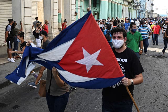 <p>People taking part in a demonstration to support the government of Cuban president Miguel Diaz-Canel in Havana</p>