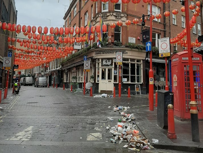 Litter lines the streets of London’s Chinatown district