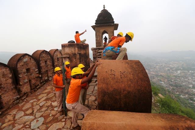 <p>State Disaster Response personnel perform a search operation at a watchtower of the 12th century Amber Fort where 11 people were killed Sunday after being struck by lightning in Jaipur, Rajasthan</p>