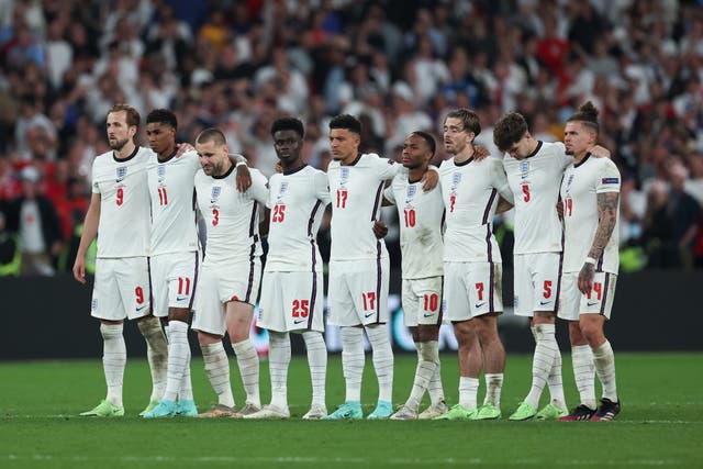 <p>Members of the England football team stand together in the final of the Euro 2020 final against Italy on 11 July 2021</p>