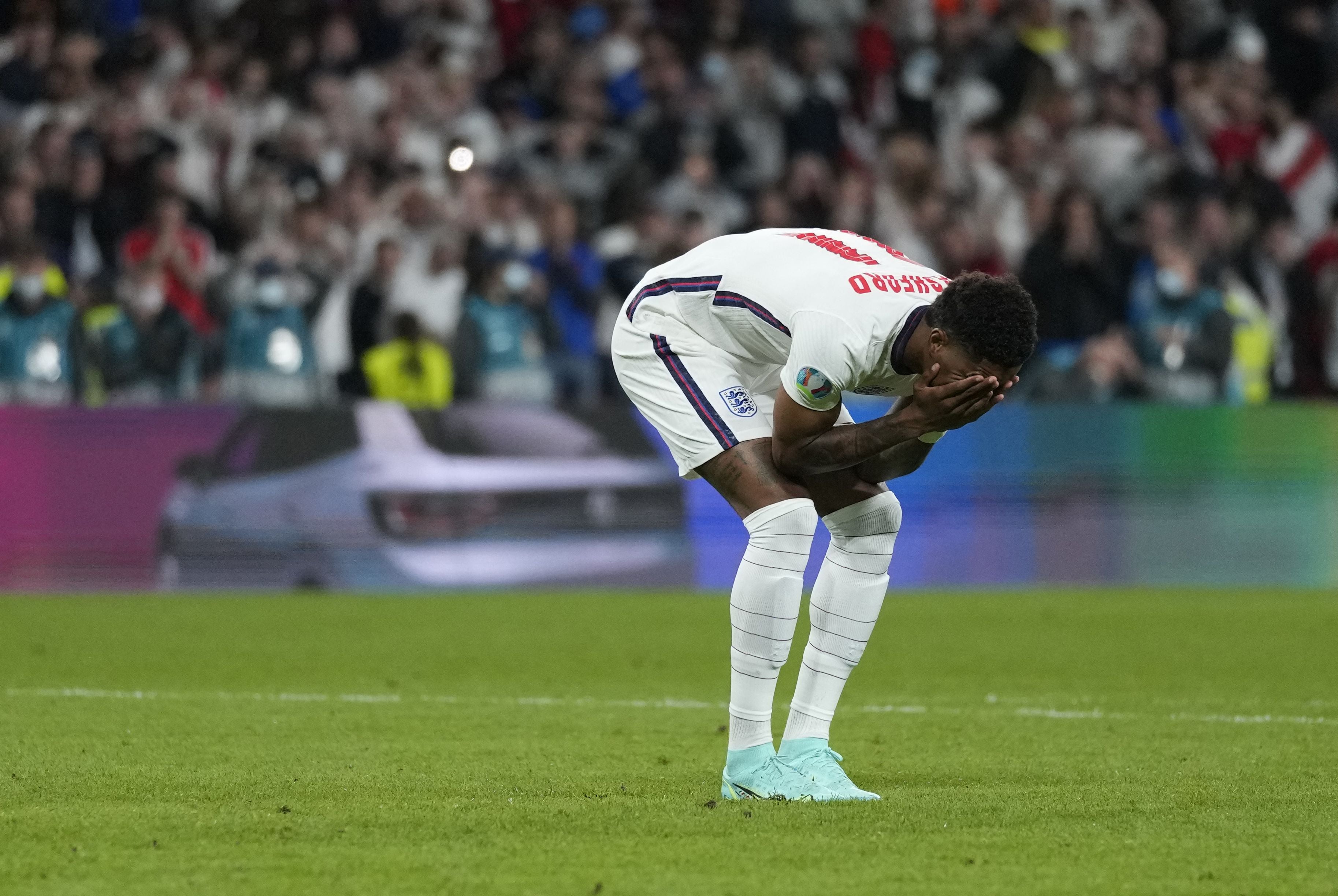 Marcus Rashford is distraught after failing to score in the penalty shootout