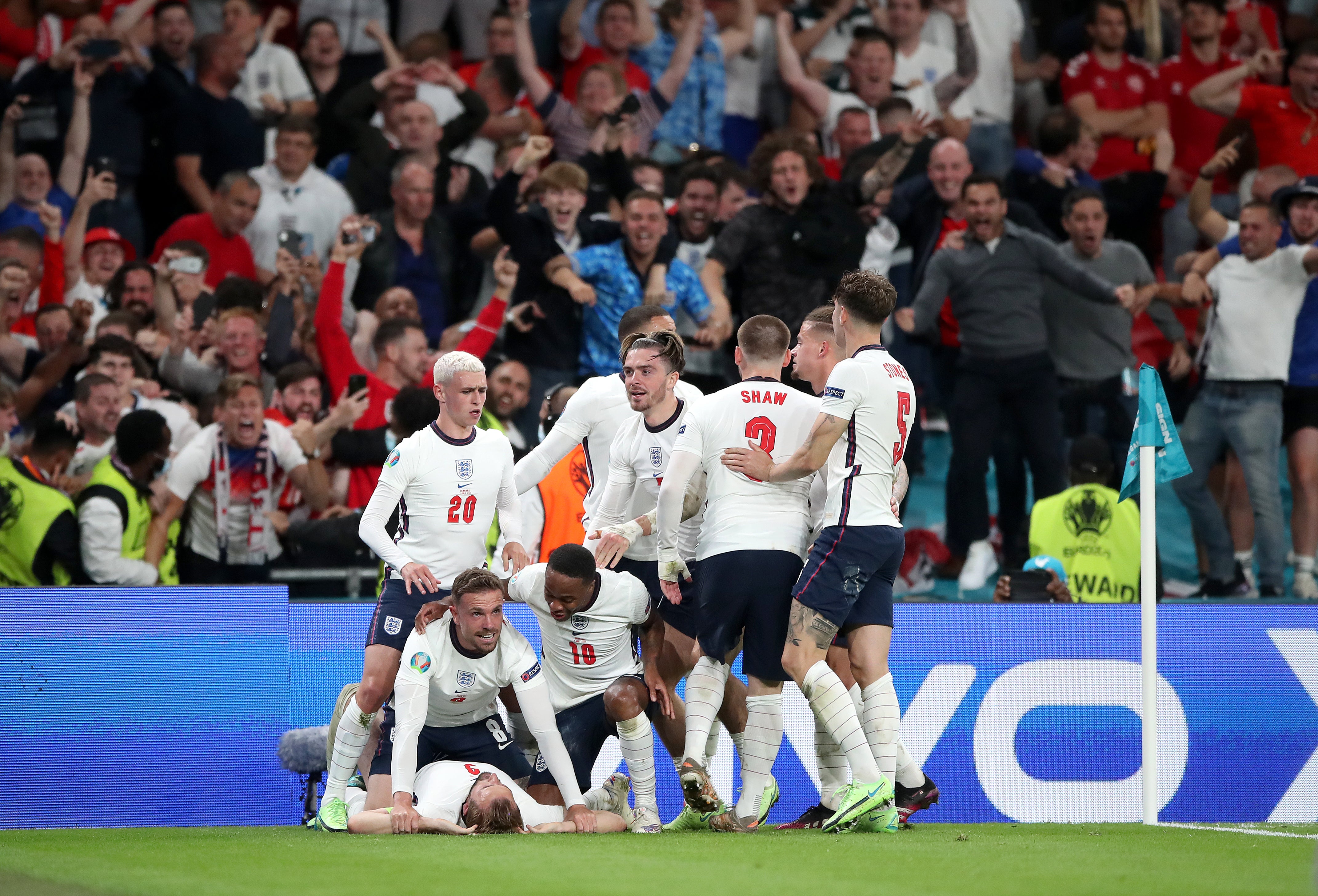 Harry Kane is mobbed by team-mates after scoring the goal that took England to the final