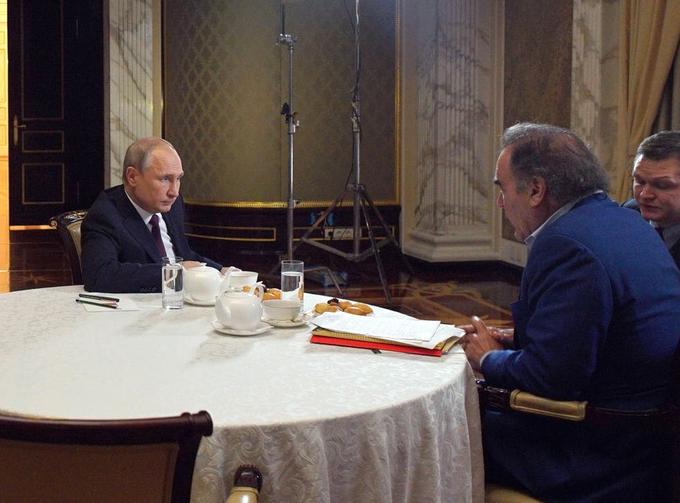 <p>Stone interviews Russian president Vladimir Putin in 2019</p>