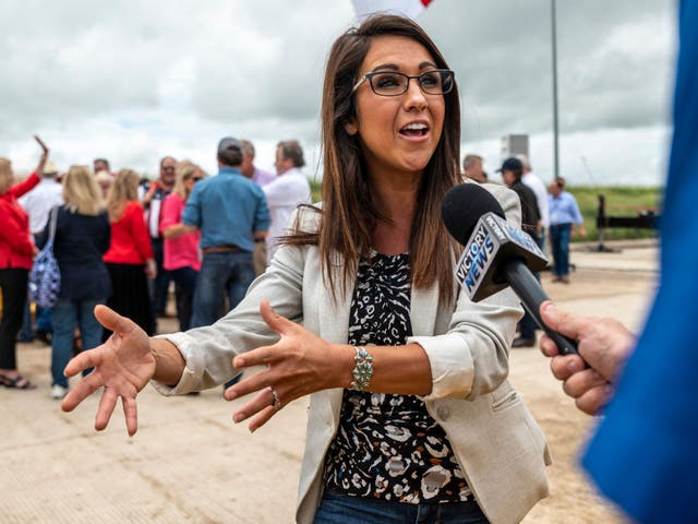<p>US Rep. Lauren Boebert (R-CO) speaks to a reporter during a visit to the border wall near Pharr, Texas on June 30, 2021.</p>