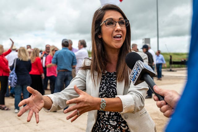 <p>US Rep. Lauren Boebert (R-CO) speaks to a reporter during a visit to the border wall near Pharr, Texas on June 30, 2021.</p>