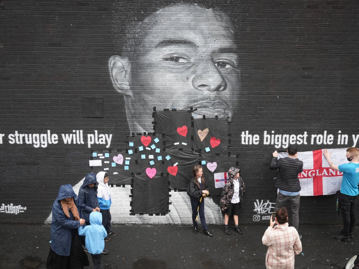 Close up of a small part of the giant Manchester United player Marcus  Rashford mural in Withington, Manchester, England, United Kingdom, that was  vandalised with abusive graffiti after England's Euro2020 football loss