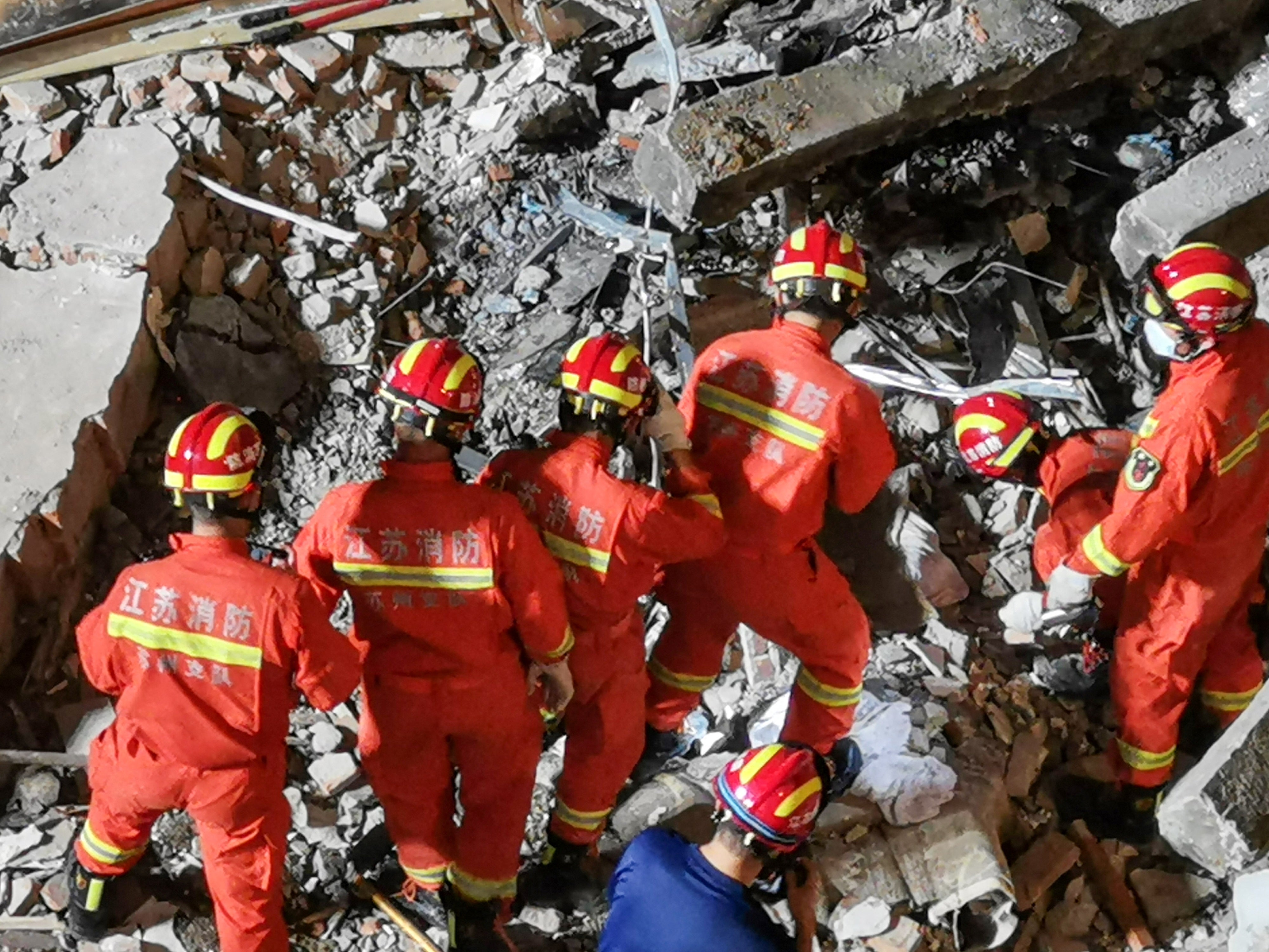 Rescuers searching at the site of a hotel after it collapsed leaving at least eight dead and nine others missing in the city of Suzhou in China’s eastern Jiangsu province