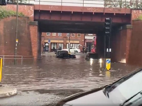 Floodwaters submerge cars in Raynes Park in Wimbledon
