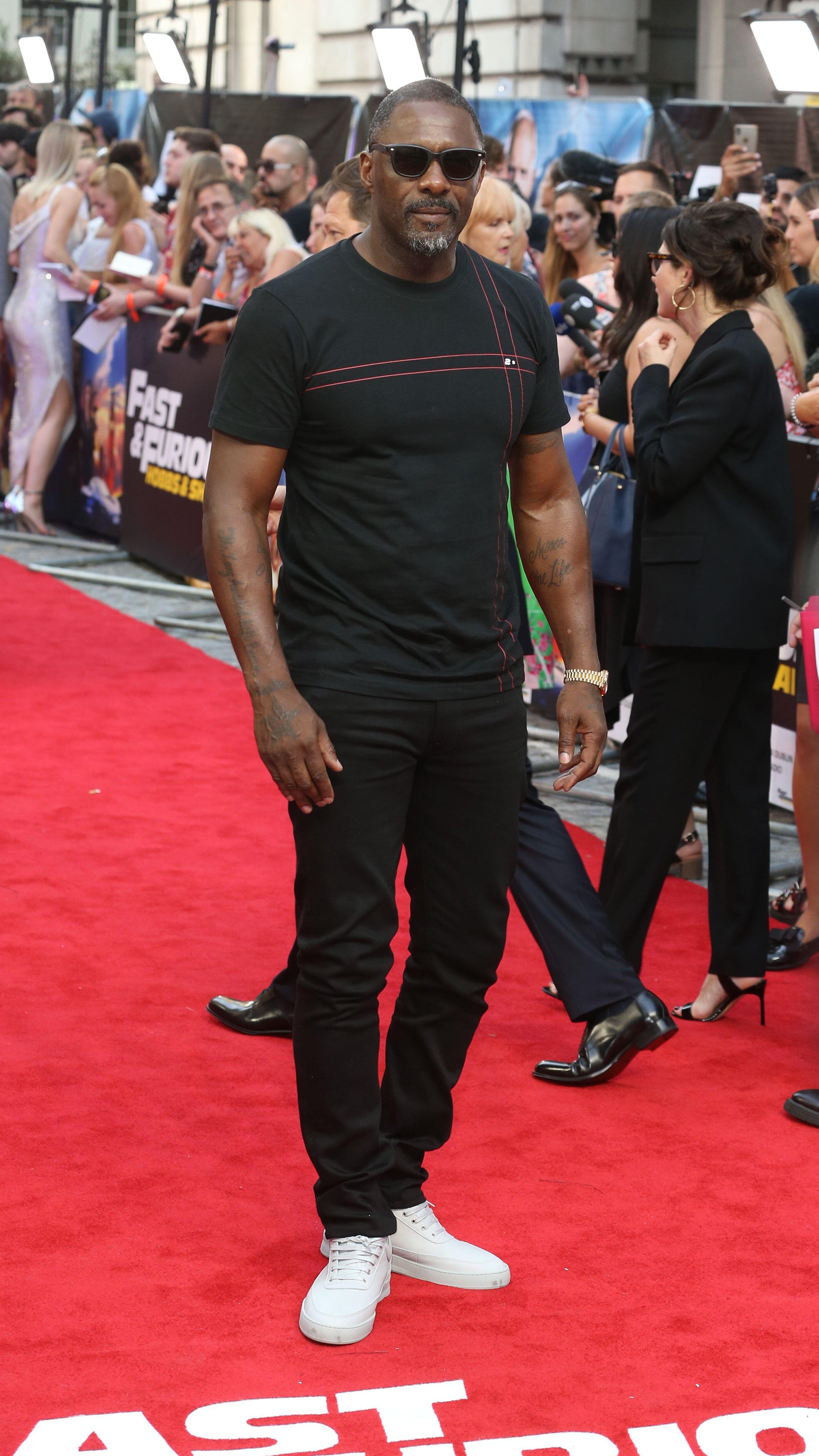Idris Elba wearing trainers on the red carpet