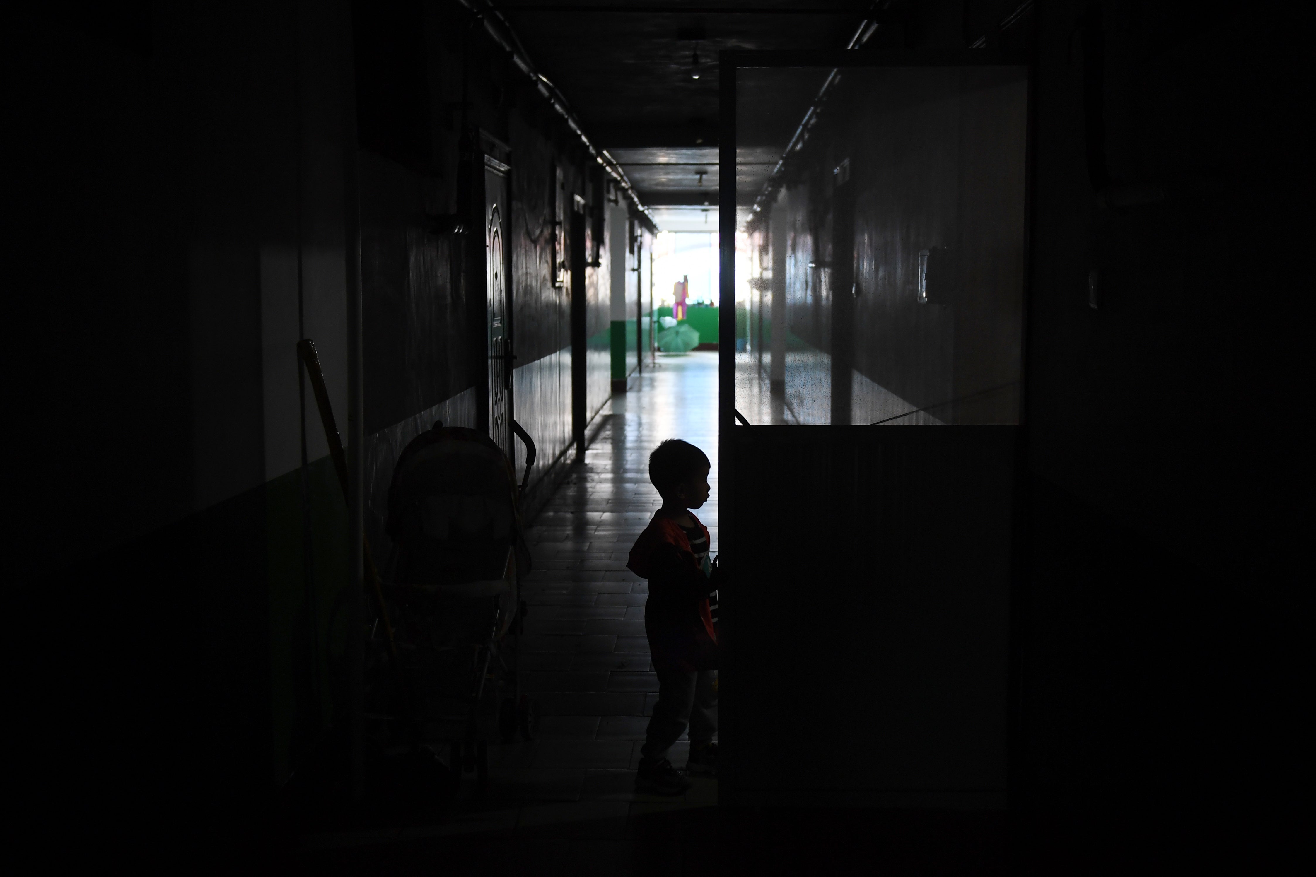 Representative image: A child plays in the corridor of an apartment building in China’s Henan province on 29 September 2017