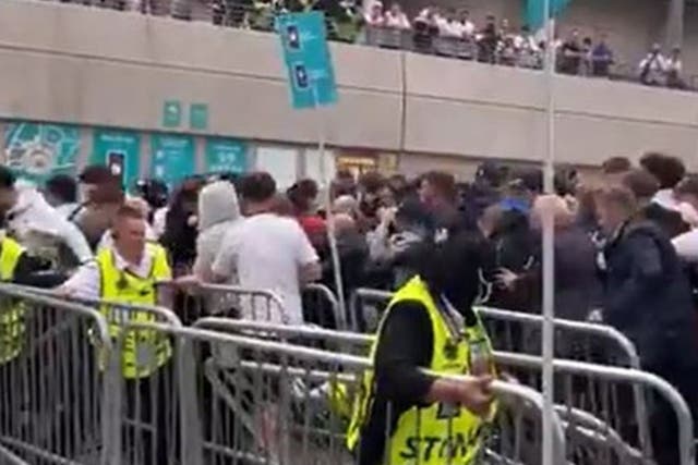 <p>Fans rushed through barriers at Wembley stadium before the Euro 2020 final </p>