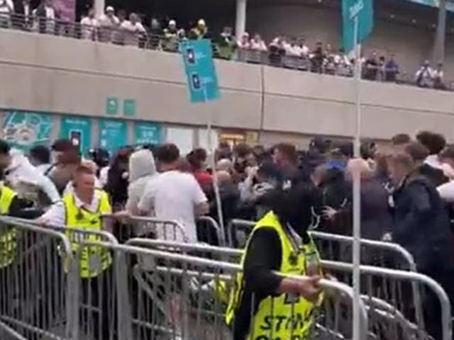 <p>Fans rushed through barriers at Wembley stadium before the Euro 2020 final </p>