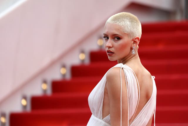 Iris Law poses for photographers upon arrival at the premiere of the film 'The French Dispatch' at the 74th international film festival, Cannes, southern France, Monday, July 12, 2021