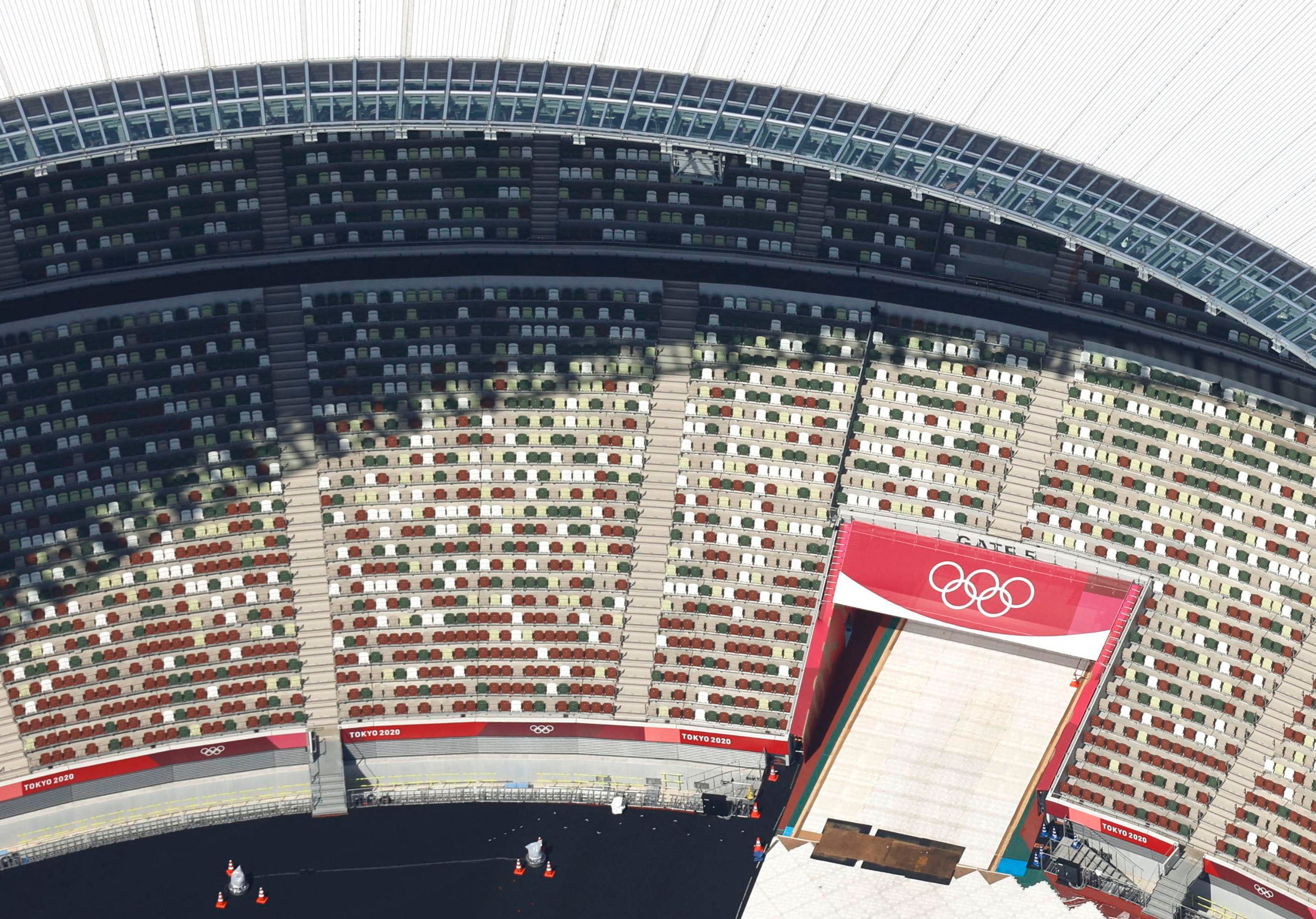 File: This aerial photo shows the Olympic Rings at the National Stadium in Tokyo on 21 June 2021