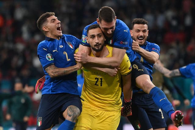 <p>Italy's goalkeeper Gianluigi Donnarumma celebrates with teammates after his shootout heroics won the Euro 2020 final on Sunday</p>