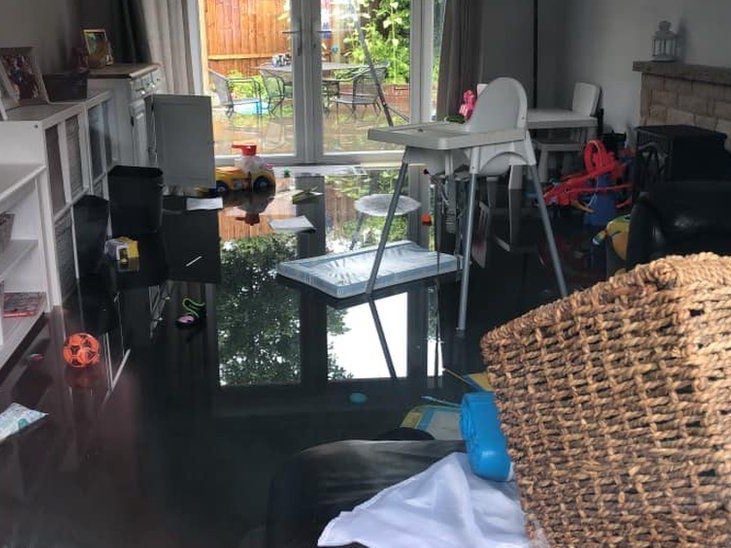 The family’s home in Poole was submerged in ankle-deep sewage water