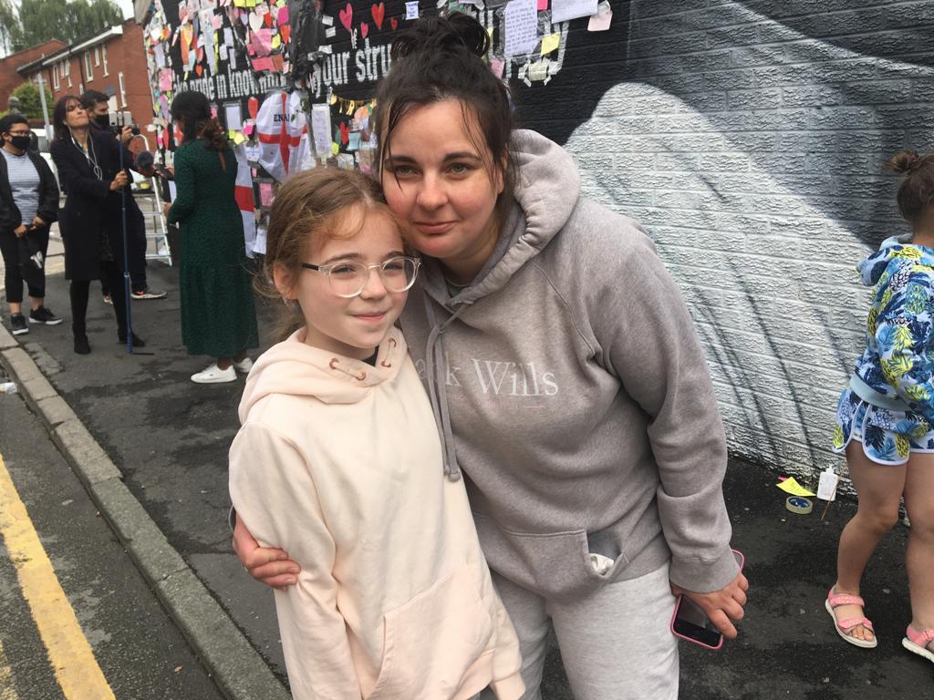 Linsey Eyre brought 10-year-old daughter Martha from their home in Didsbury to stick up a message on Tuesday morning