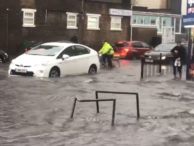 <p>A flooded road in Turnpike Lane, north London</p>