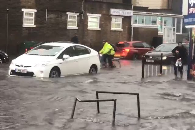 <p>A flooded road in Turnpike Lane, north London</p>