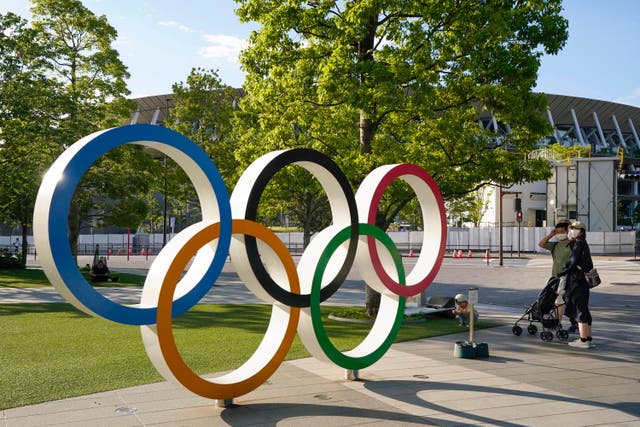 <p>Olympic rings outside the New National Stadium</p>