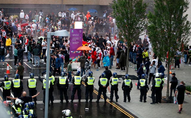 <p>Police form a cordon outside Wembley</p>