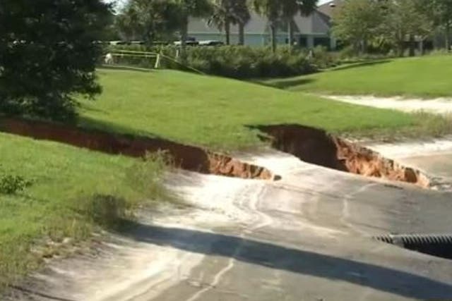 <p>Two of three sinkholes that opened up in The Villages in Florida on Monday.</p>