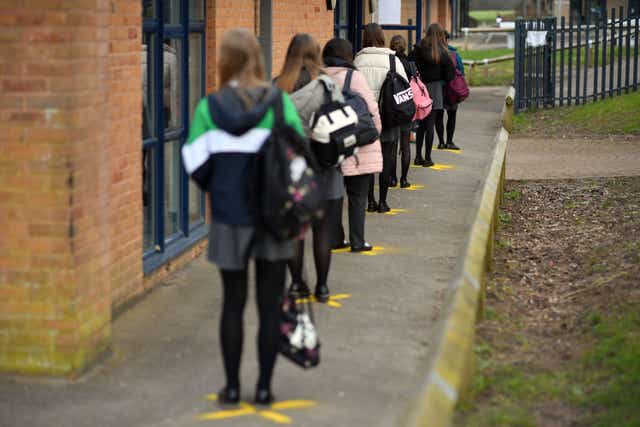 <p>Pupils queuing to take a lateral flow test at Archway School in Stroud, Gloucestershire, in March this year</p>