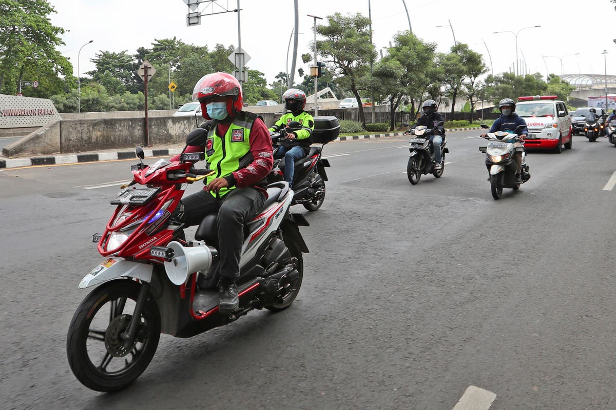 AP PHOTOS: Bikers clear Indonesian streets for ambulances