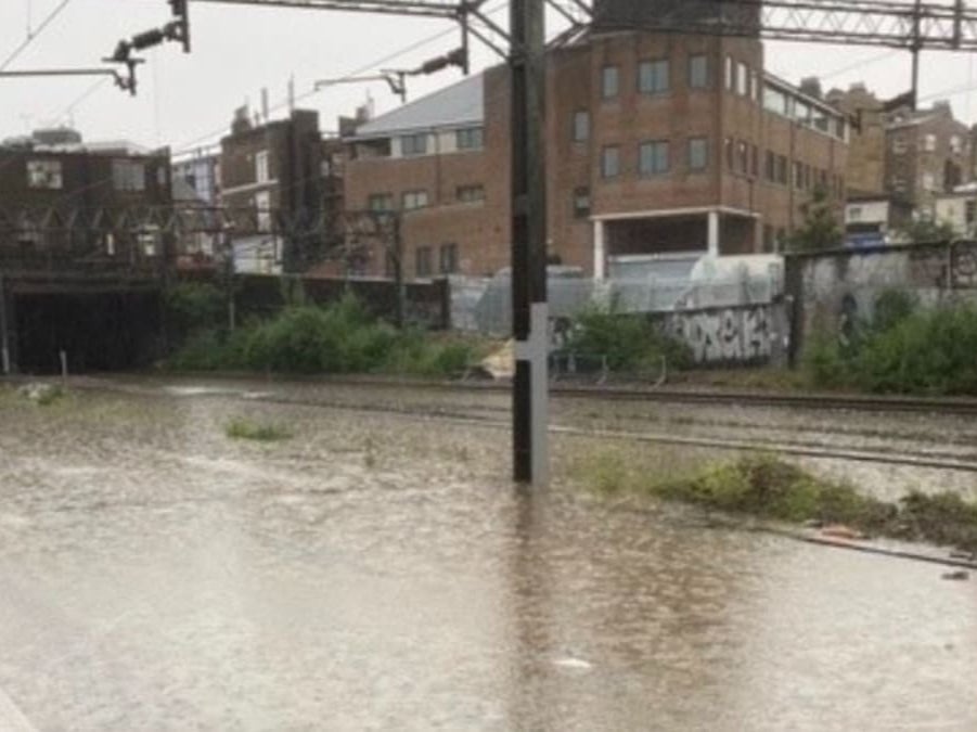 Rain line: flooding outside Euston station in London
