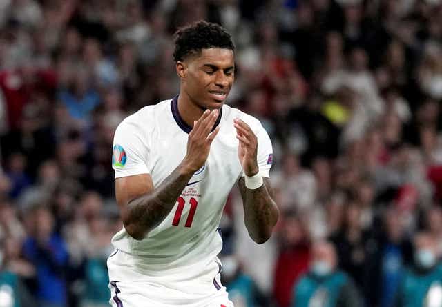 <p>Marcus Rashford looks dejected after missing his penalty in Sunday night’s final</p>