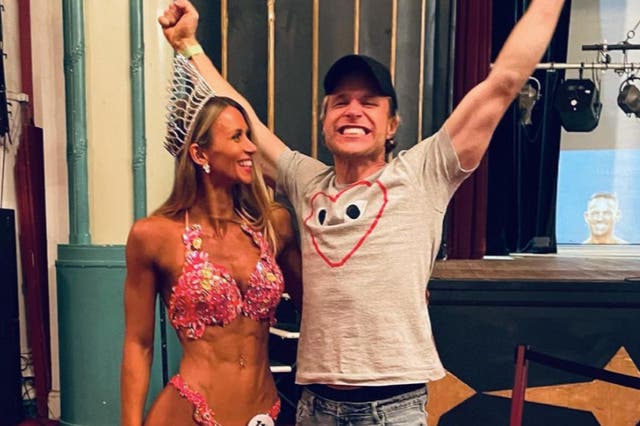 <p>Amelia Tank and Olly Murs celebrate after Tank was crowned as overall UK winner of the Pure Elite bodybuilding competition last month</p>