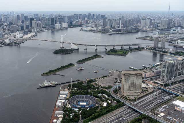 <p>Tokyo Bay, Odaiba Marine Park and the Tokyo Olympic beach volleyball stadium are pictured from a helicopter on 26 June 2021 in Tokyo, Japan</p>