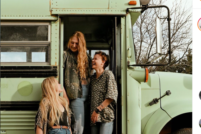 <p>Bekah, Abi and Morgan pose next to the bus they purchased to follow their dreams of travelling across the country after they joined together by heartbreak over the same boy.</p>