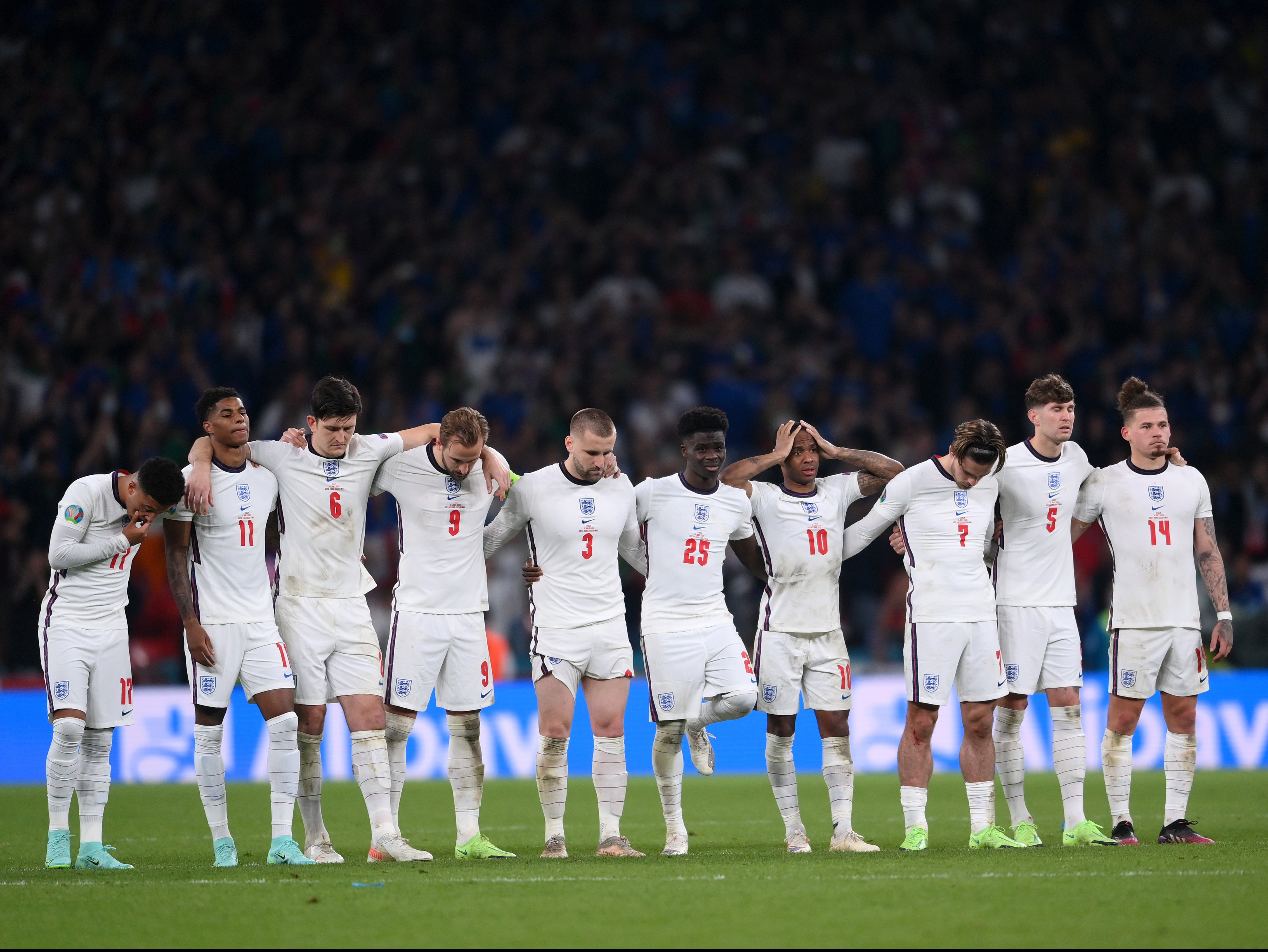 <p>England players look on during the penalty shoot out during the UEFA Euro 2020 Championship final against Italy</p>