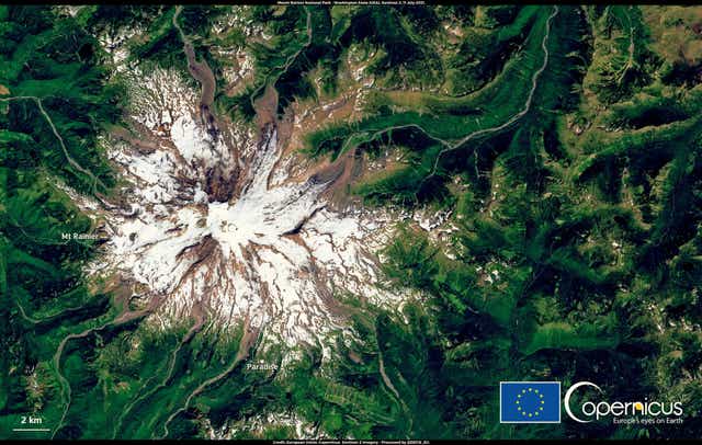 <p> This satellite image, from 11 July 2021, shows the extent of the snow melt at Mount Rainier National Park in Washington state </p>