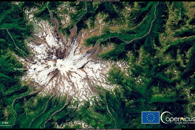 <p> This satellite image, from 11 July 2021, shows the extent of the snow melt at Mount Rainier National Park in Washington state </p>