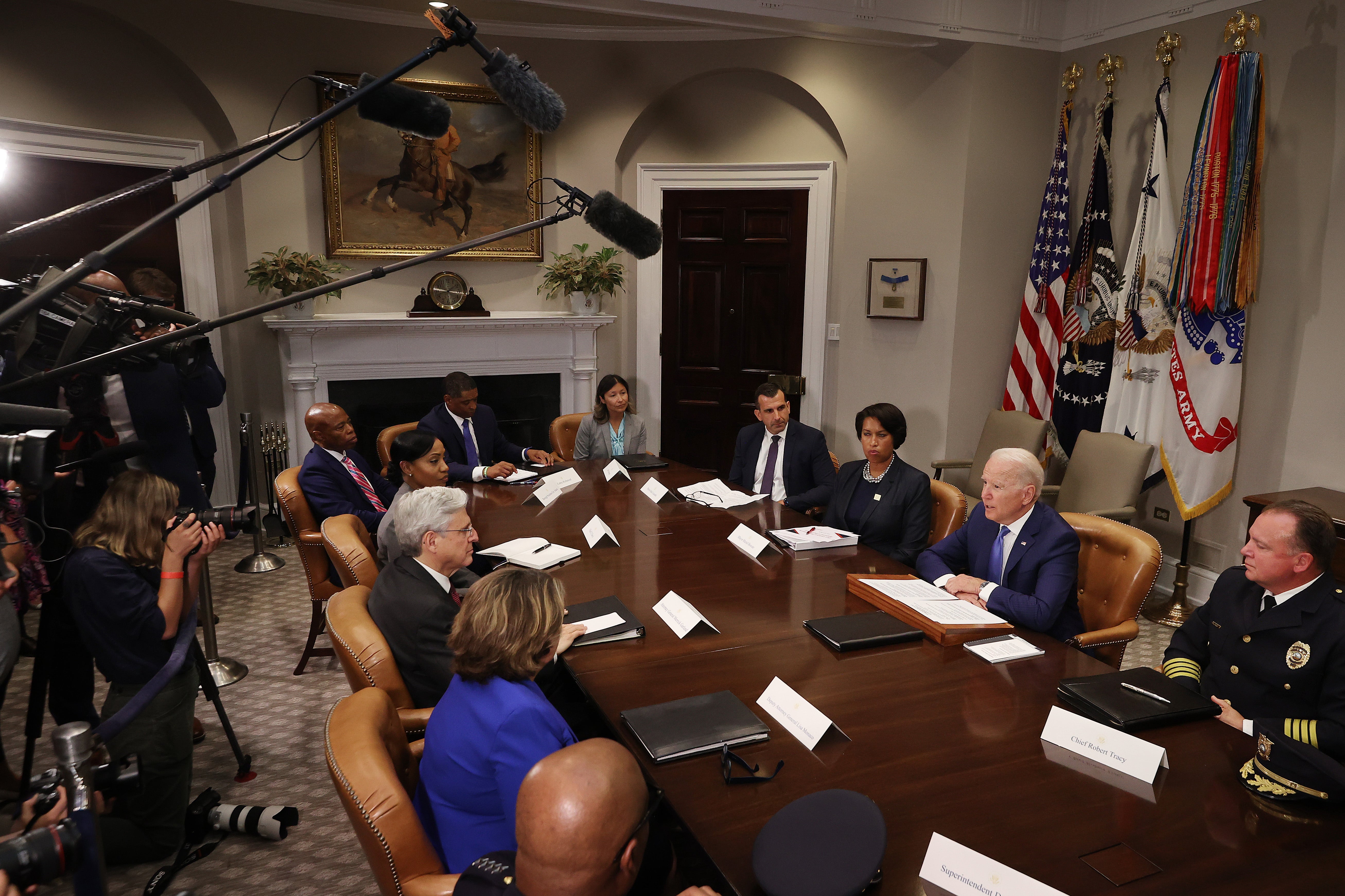 Eric Adams, back left, sits opposite Joe Biden at the White Houes to discuss gun violence